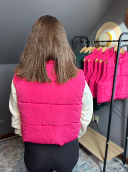 hot pink puffer vest with cream cropped sweatshirt