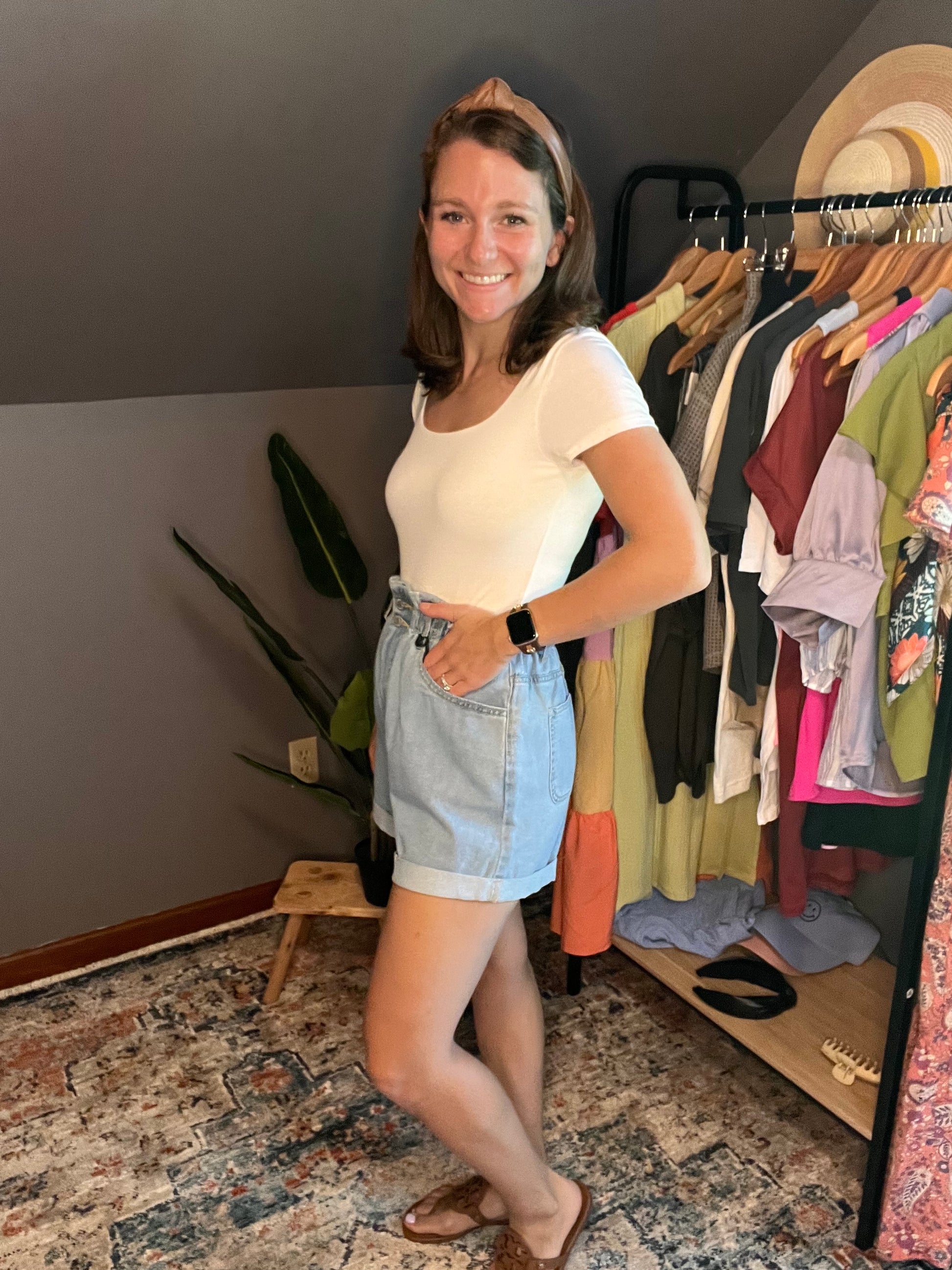 white short sleeved square neck bodysuit with blue ruffle shorts 