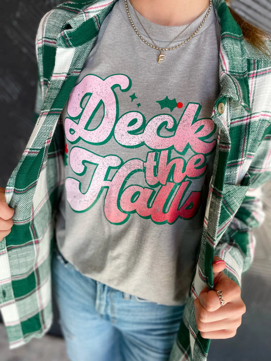 deck the halls graphic tee pink script with green outline on a gray tee