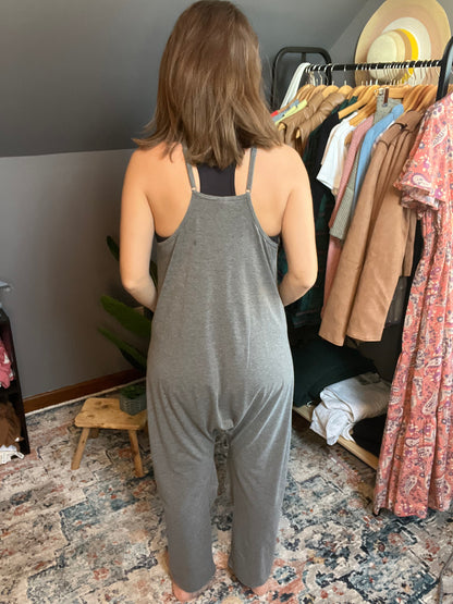 gray lounge jumpsuit paired with black brami 